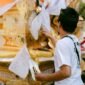 Keluarga Tionghoa membersihkan makam dan mempersiapkan sesaji saat upacara sembahyang kubur, sebuah tradisi turun-temurun yang melambangkan bakti kepada leluhur. Asap dupa dan kertas sembahyang memenuhi udara, menyampaikan doa dan harapan kepada arwah yang telah mendahului.