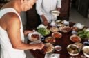 Berbagai hidangan Peranakan tersaji di meja, memperlihatkan kekayaan warna dan kelezatan yang menggugah selera, hasil perpaduan budaya Tionghoa dan Melayu yang harmonis. Setiap piring menceritakan kisah panjang akulturasi yang melahirkan cita rasa khas Nusantara.